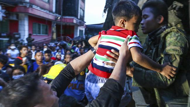 Residents are evacuated as heavy ash and debris from the Taal volcano eruption continues to fall. Picture: AP