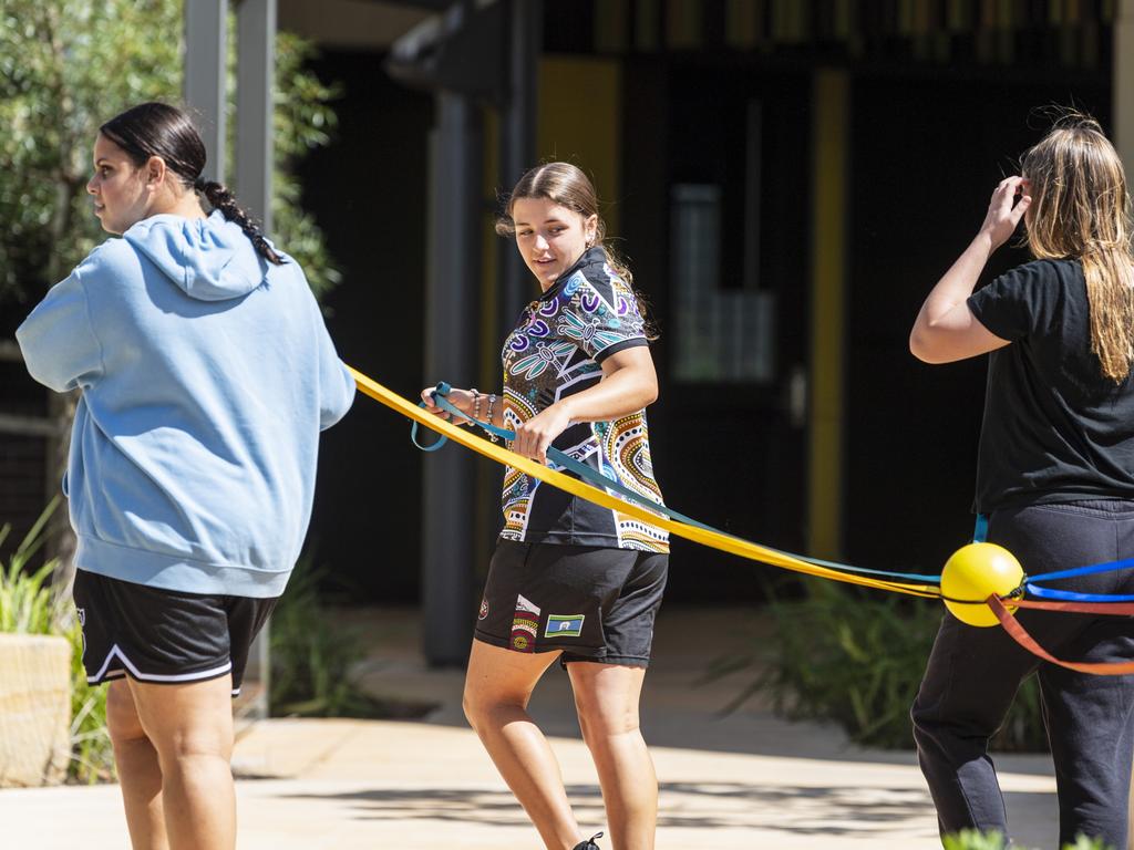 Project Booyah youth program participants (from left) Kadisha, Holly and Hanna on a team building problem solving exercise in Toowoomba at Denise Kable Youth Services Centre, Tuesday, March 12, 2024. Picture: Kevin Farmer