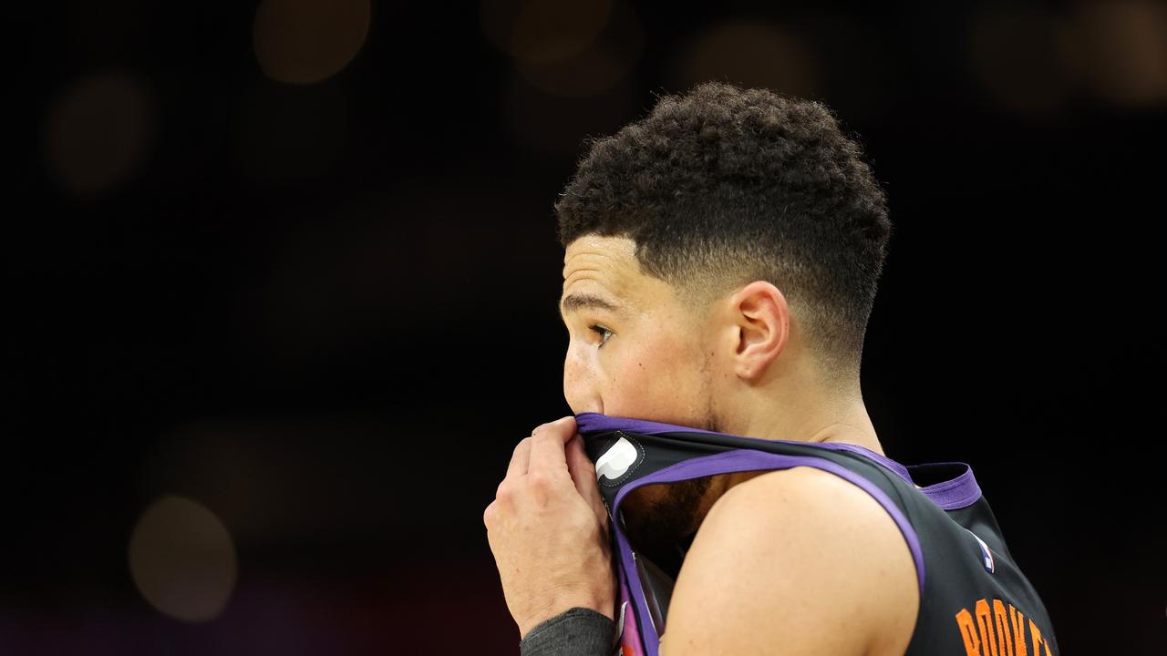 PHOENIX, ARIZONA - MAY 15: Devin Booker #1 of the Phoenix Suns reacts during the first half in Game Seven of the 2022 NBA Playoffs Western Conference Semifinals against the Dallas Mavericks at Footprint Center on May 15, 2022 in Phoenix, Arizona. NOTE TO USER: User expressly acknowledges and agrees that, by downloading and/or using this photograph, User is consenting to the terms and conditions of the Getty Images License Agreement. (Photo by Christian Petersen/Getty Images)