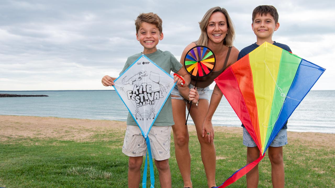 Judd Smith, Sara Vaughan and Michael Smith gets ready for the kite festival held at Cullen Bay. Picture: Pema Tamang Pakhrin