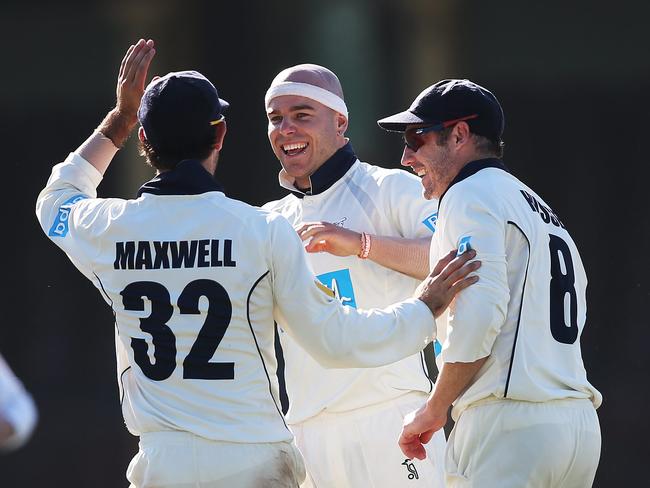 Jayde Herrick celebrates with Glenn Maxwell and David Hussey after dismissing Steve Smith.