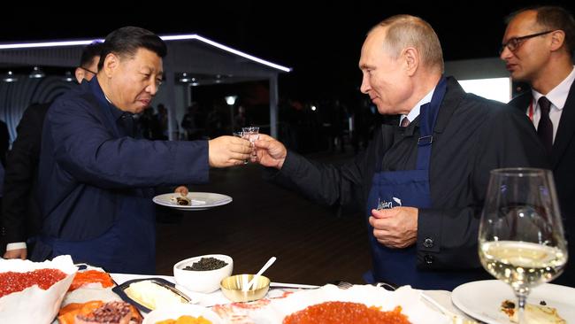 Russian President Vladimir Putin toasts with his Chinese counterpart Xi Jinping. Picture: Sergei Bobylyov