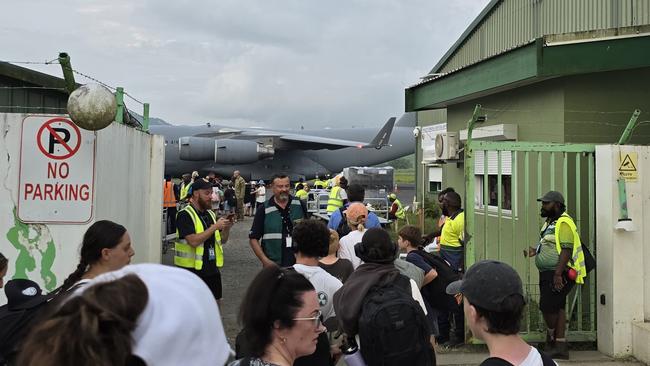 Australians are in line to evacuate on Royal Australian Air Force's Boeing C17A Globemaster III in Port Villa, Vanuatu. Picture: Supplied