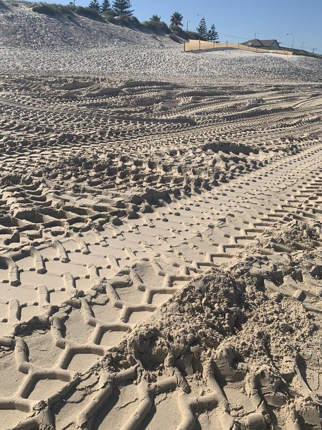 Tracks left at West Beach after recent emergency sand carting. Picture: Paula Thompson