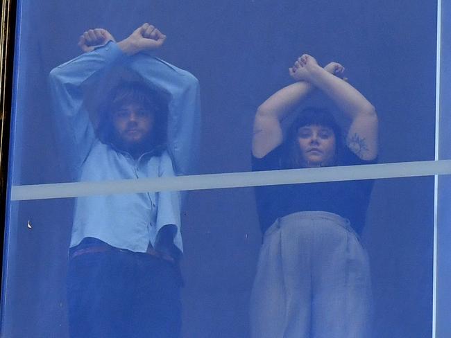 Jarrah Kershaw (left) and Laura Harland gesture in protest before a court appearance in the District Court in Brisbane. Picture: NCA NewsWire/Dan Peled