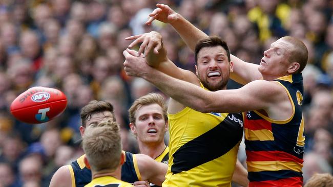 Toby Nankervis of the Tigers and Sam Jacobs of the Crows compete in the ruck.