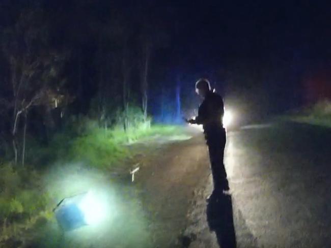 Two men are on the run after allegedly smashing a car into a service station on the Bruce Highway overnight, hooking up the ATM inside and dragging it down the highway. This is a screenshot from the video taken by police after the two men took off.