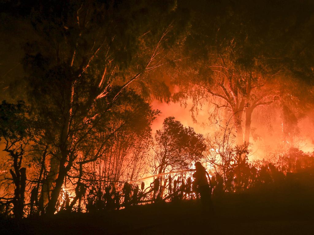 A firefighter battles the Woolsey Fire in Malibu. Picture: AP