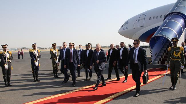 Russian President Vladimir Putin (centre) arrives at the airport in Tehran. Picture: AFP