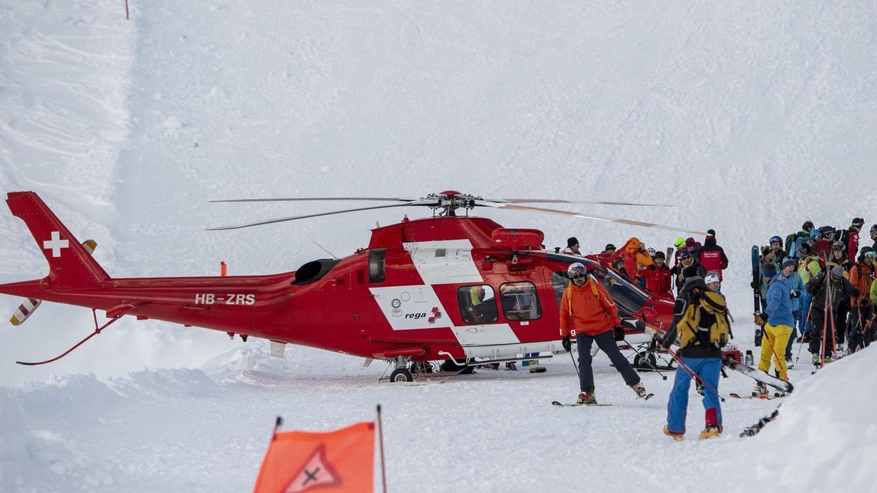 Rescue forces search for possible victims of a Swiss avalanche. Picture: AP