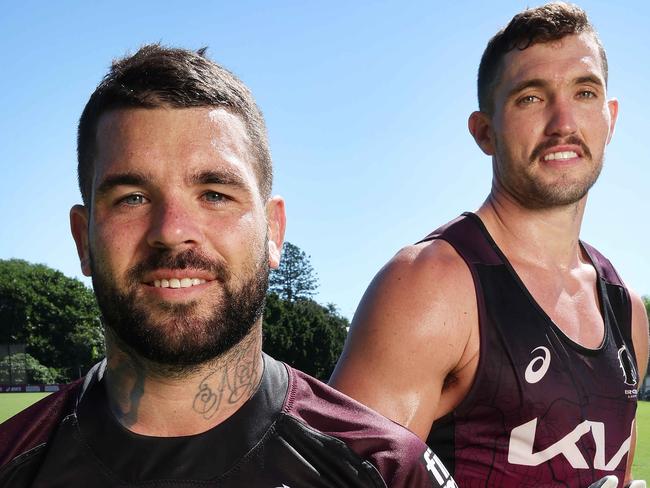 Adam Reynolds and Corey Oates with their boots that are to auctioned for charity, Brisbane Broncos training, Red Hill. Picture: Liam Kidston