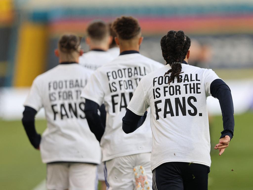 Leeds United players wear T-shirts with slogans against a proposed new European Super League.