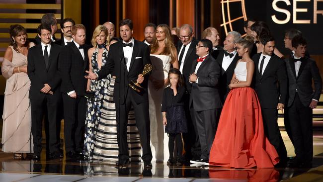 Five years in a row ... Modern Family creator Steven Levitan with cast and crew accepts the Outstanding Comedy Series Emmy Picture: Getty