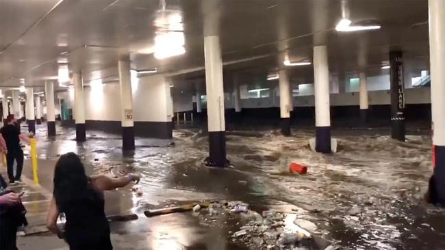 Waters rushed into underground carparks, washing away anything not tied down. Picture: Twitter / @CoachKenCamp