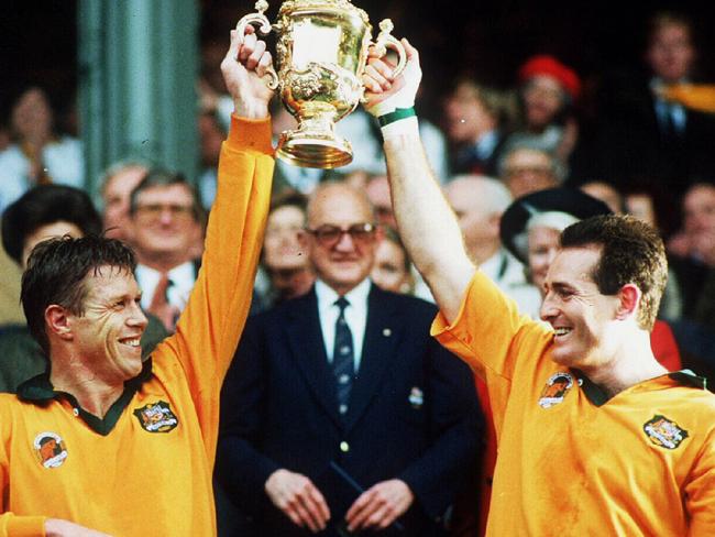 David Campese (R) hold Webb Ellis 1991 Rugby World Cup Trophy after Wallabies win over England in final.