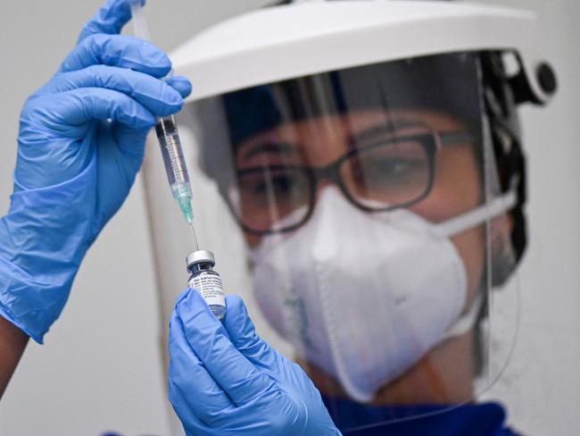 A doctor prepares a dose of the COVID-19 vaccine. Picture: AFP