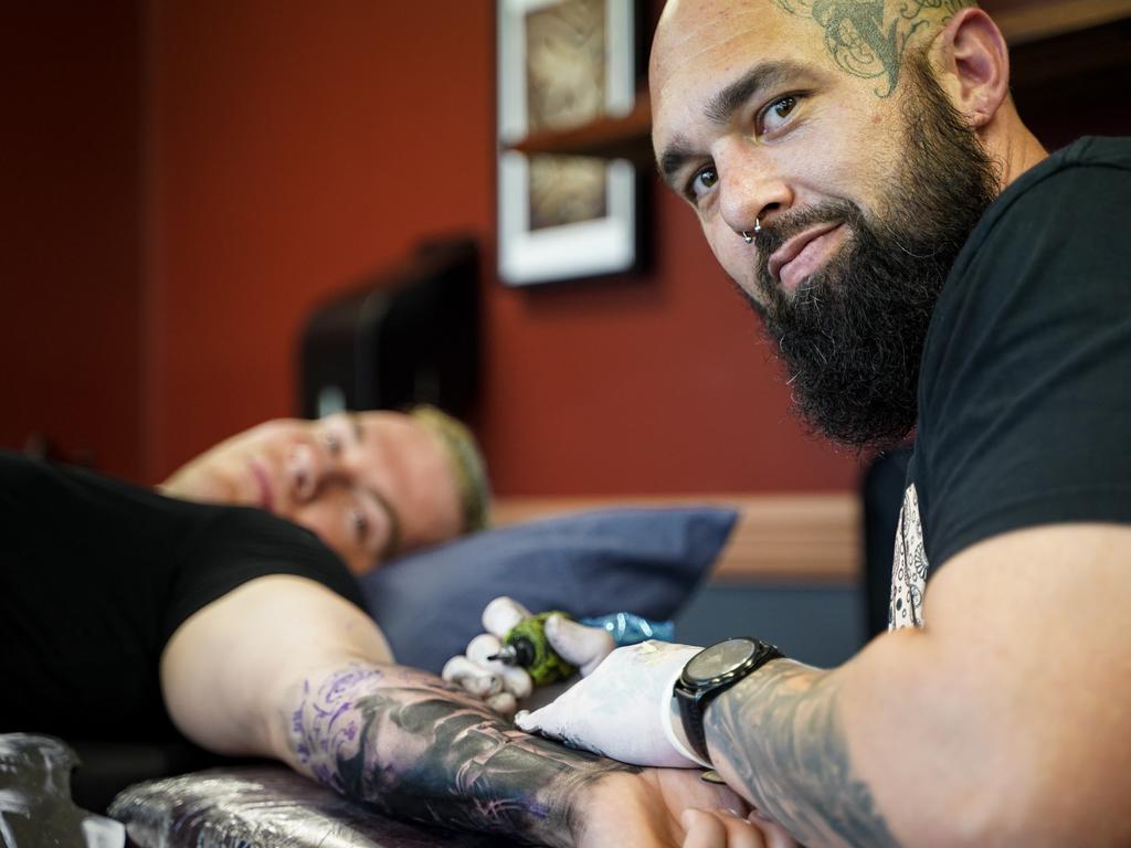 Tri Tone Tattoo owner and tattooist Mitchell Brammer working on a realism horror piece for Mitchell Norton. Picture: Heidi Petith