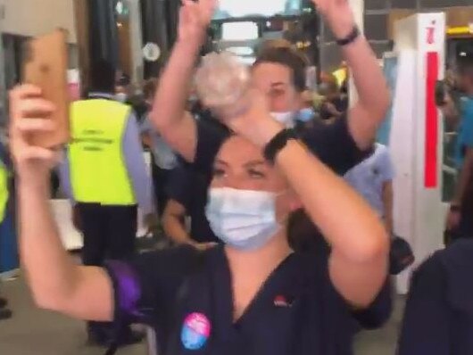 Video still from Facebook of striking Blacktown Hospital nurses walking off the job today. Source: Facebook - https://www.facebook.com/nswnma/videos/391228402067419