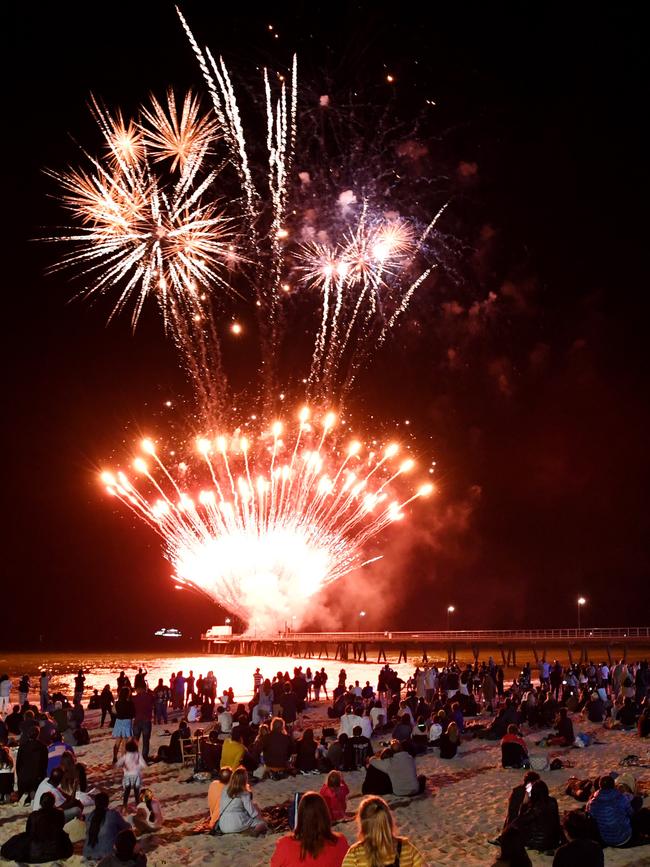 Revellers watch the fireworks on New Year’s Eve in Glenelg.