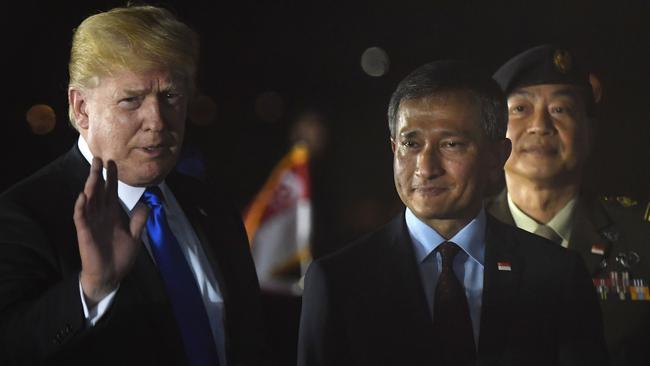 Donald Trump is greeted by Singapore Foreign Minster Vivian Balakrishnan last night. Picture: AFP