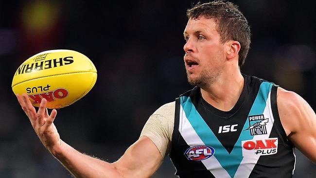 Travis Boak keeps his eye on the ball against the Eagles. Picture: Daniel Kalisz/Getty Images