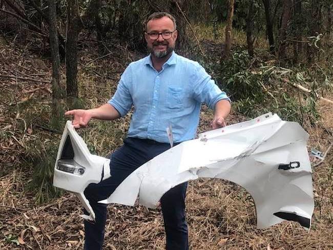 Jeffrey Horsey with parts of his car that was stolen and dumped.