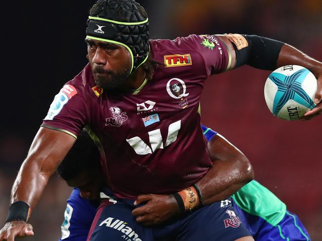 BRISBANE, AUSTRALIA - MARCH 12: Seru Uru of the Reds is tackled during the round four Super Rugby Pacific match between the Queensland Reds and the Fijian Drua at Suncorp Stadium on March 12, 2022 in Brisbane, Australia. (Photo by Chris Hyde/Getty Images)