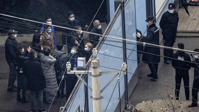 World Health Organisation investigators at Huanan seafood market on January 31. Picture: Getty Images