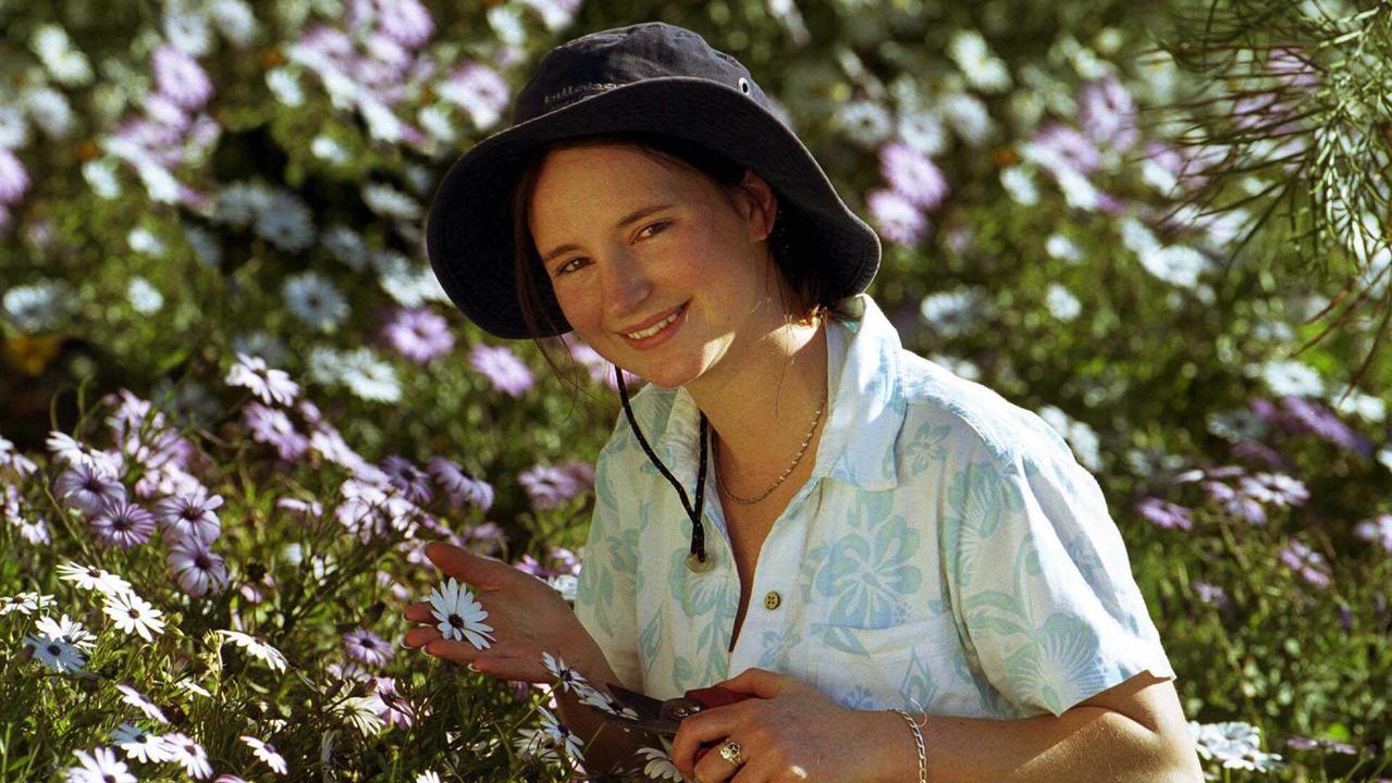 Carnival of Flowers Queens Nicole Burnie enjoying the last days of her rein picking flowers from the cottage garden of Gordon and Viv Palm in Toowoomba. Pic: David Martinelli