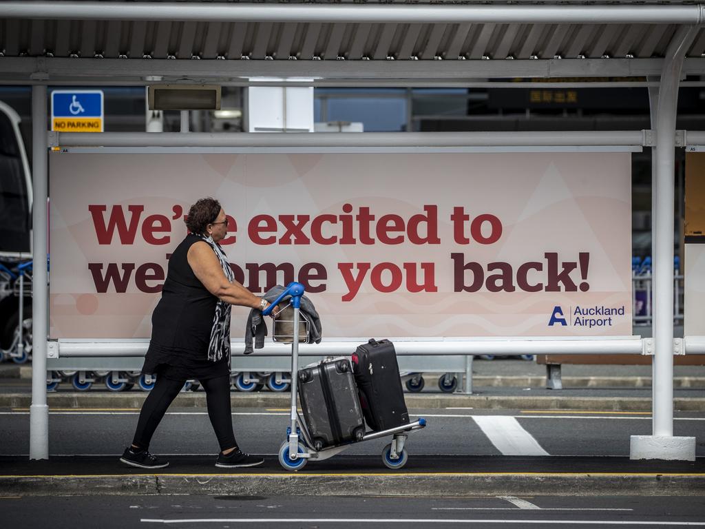 A quarantine-free traveller arrives at Auckland International Airport on Monday, as an airport cleaner tests positive to COVID-19 despite being vaccinated. Picture: NZ Herald / Michael Craig