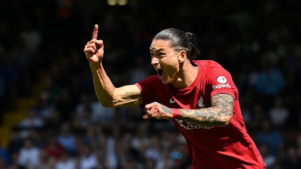 TOPSHOT - Liverpool's Uruguayan striker Darwin Nunez celebrates after scoring their first goal during the English Premier League football match between Fulham and Liverpool at Craven Cottage in London on August 6, 2022. (Photo by JUSTIN TALLIS / AFP) /