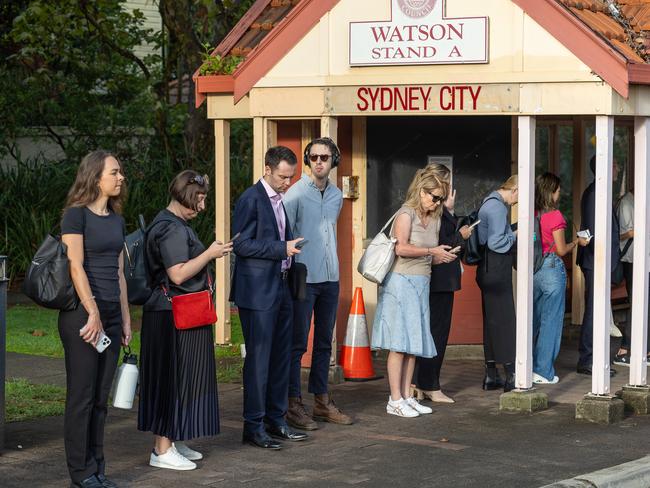 Commuters waiting at Watson St bus stop in Neutral Bay on Wednesday morning. Picture /Thomas Lisson