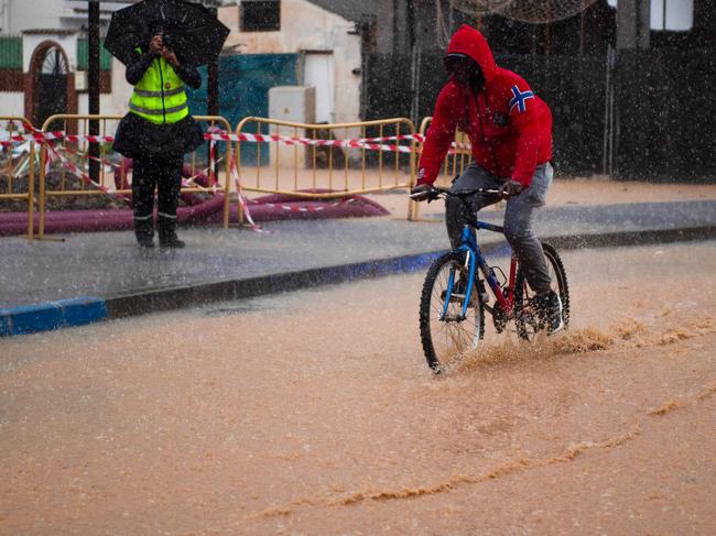 A man braves the conditions in Campanillas, in Malaga. Picture: AFP