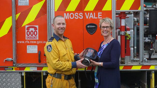 Kate Vines from Rare Cancers presenting Brendon with one of the masks. Picture: Supplied.