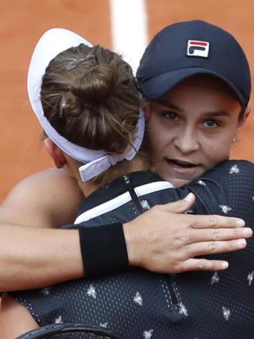 Ash Barty embraces Marketa Vondrousova.