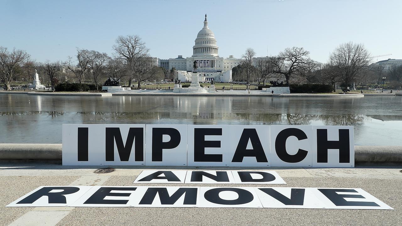 Demonstrators call for the impeachment and removal of US President Donald Trump outside the US Capitol. Picture: Getty Images