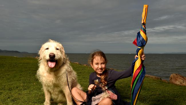 Remy Moore, 5, with Cooper is ready for rain on the strand. Picture: Evan Morgan