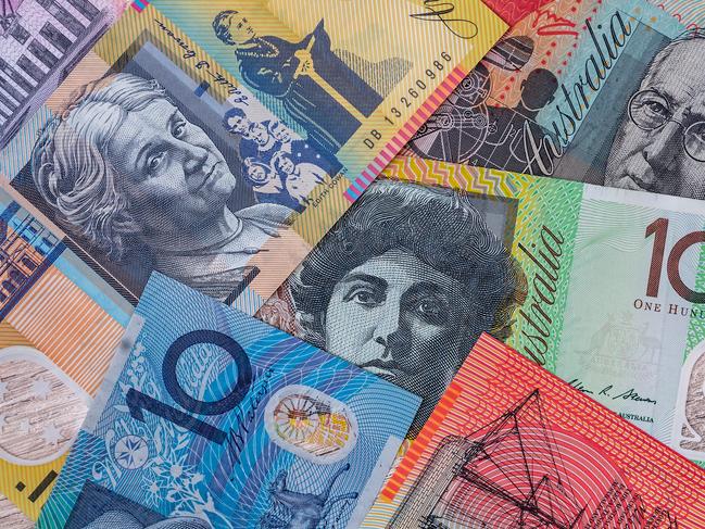 Australian dollar banknotes on wooden table background