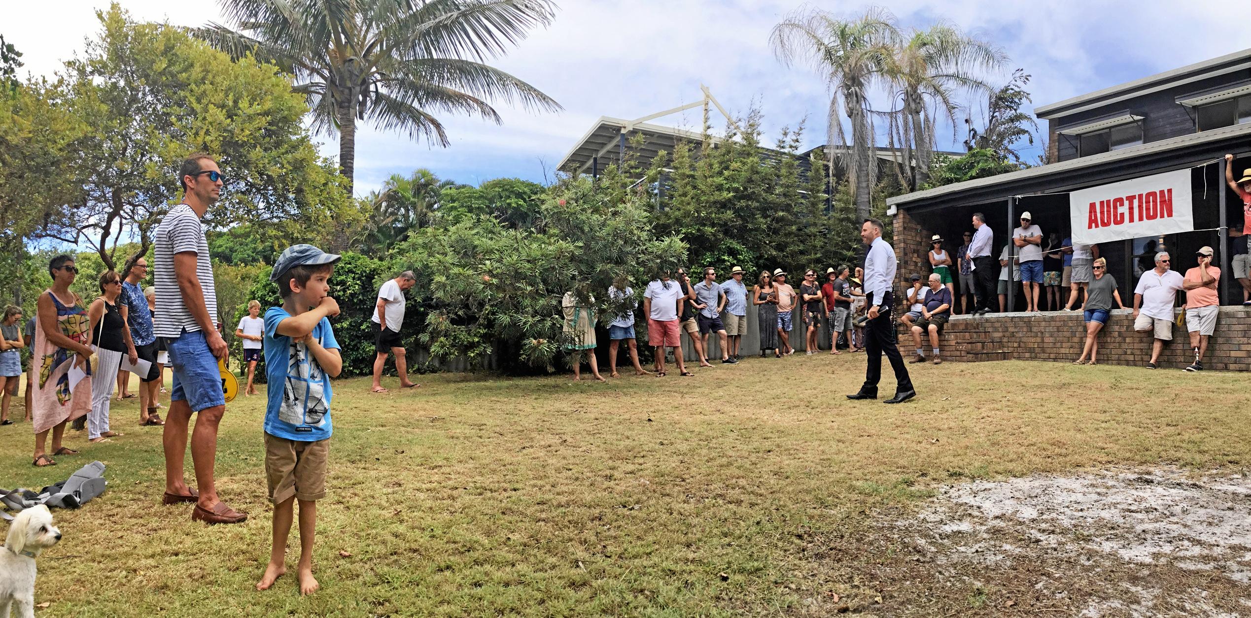 Auctioneer Gordon Macdonald calls the bids at 66 Lorikeet Dr, Peregian Beach, on Saturday morning with Kerry Glover of North Shore Realty.