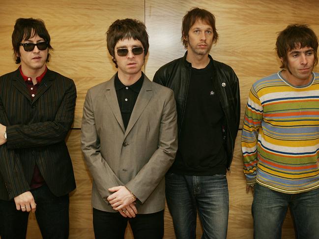 (FILES) In this file photo taken on February 25, 2006 (From L) Gem, Noel Gallagher, Andy Bell and Liam Gallagher, members of the British rock band "Oasis" pose for a photograph during a photocall in Hong Kong. - Noel Gallagher's Gibson guitar, broken one night in 2009 at the same time as the band Oasis imploded, found a buyer on May 17, 2022 for 385,500 euros, during an auction in Paris. (Photo by Mike CLARKE / AFP)