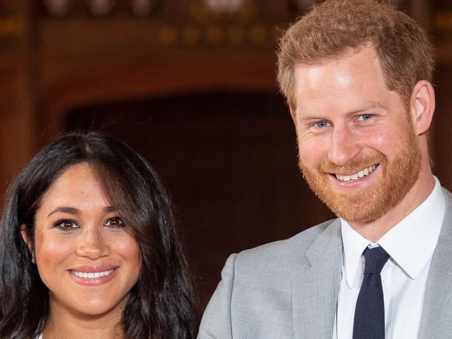 (FILES) In this file photo taken on May 08, 2019 Britain's Prince Harry, Duke of Sussex (R), and his wife Meghan, Duchess of Sussex, pose for a photo with their newborn baby son, Archie Harrison Mountbatten-Windsor, in St George's Hall at Windsor Castle. - Prince Harry and his wife Meghan's new home in Windsor cost £2.4 million ($3.05 million, 2.7 million euros) of taxpayers' money to renovate, royal accounts showed on June 25, 2019, prompting criticism from anti-monarchy campaigners. (Photo by Dominic Lipinski / POOL / AFP)