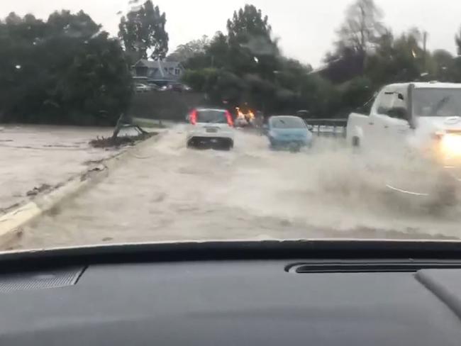 David Forest captured footage of the last cars to cross Lavenders Bridge before it was closed due to flooding on Friday.