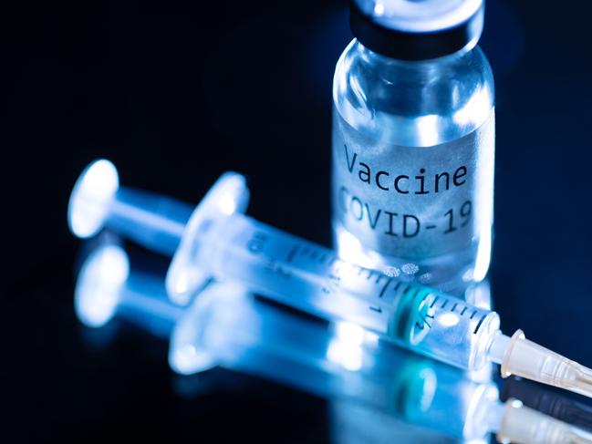 This picture taken on November 17, 2020 shows a syringe and a bottle reading "Vaccine Covid-19". - According to the World Health Organization, some 42 "candidate vaccines" against the novel coronavirus Covid-19 are undergoing clinical trials on November 17, 2020. (Photo by JOEL SAGET / AFP)