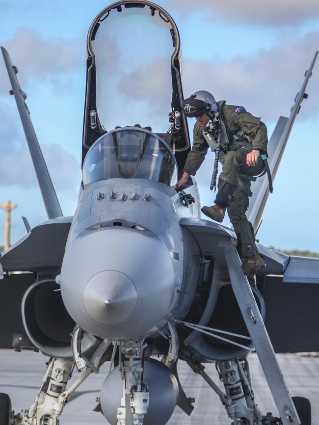 Flight Lieutenant Travis Ebersohn prepares to board a F/A-18A Hornet prior to mission launch from Andersen Air Force Base, Guam. Picture: RAAF.