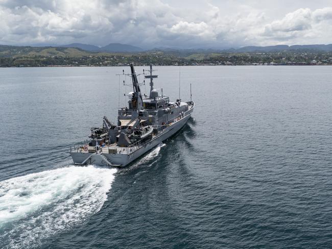 HONIARA, GUADALCANAL ISLAND, SOLOMON ISLANDS - DECEMBER 1:  In this handout provided by the Australian Department of Defence, Armadale Class Patrol Boat, HMAS Armidale, sails into the Port of Honiara on December 1, 2021 in Honiara, Guadalcanal Island, Solomon Islands. Australian defence forces have been deployed to the Solomon Islands to assist in peacekeeping efforts to following deadly anti-government protests in Honiara as people demand the resignation of Prime Minister Manasseh Sogavare. (Photo by CPL Brodie Cross/Australian Department of Defence via Getty Images)