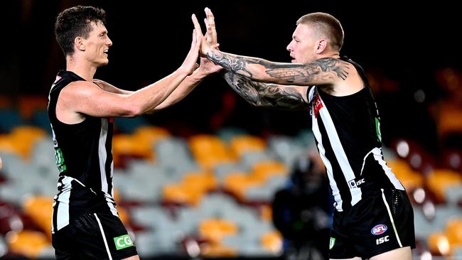 Collingwood’s Brody Mihocek, left, and Jordan De Goey celebrate a goal against Gold Coast at the Gabba in Brisbane. Picture: Getty Images