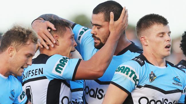 Scott Sorensen of the Sharks celebrates a try with Andrew Fifita.