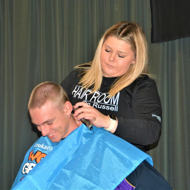 At the St Joseph's College 2023 World's Greatest Shave event is student Charlie Kruger having his hair cut by hairdresser Georgie Harwood from the Hair Room on Russell. Picture: Rhylea Millar