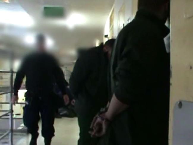 Corrective Services officers searching a cell in Parklea jail.