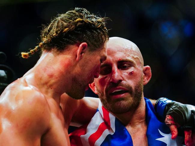 LAS VEGAS, NV - SEPTEMBER 25: Alexander Volkanovski of Australia and Brian Ortega hug after their Featherweight title fight during UFC 266 at T-Mobile Arena on September 25, 2021 in Las Vegas, Nevada. (Photo by Alex Bierens de Haan/Getty Images)